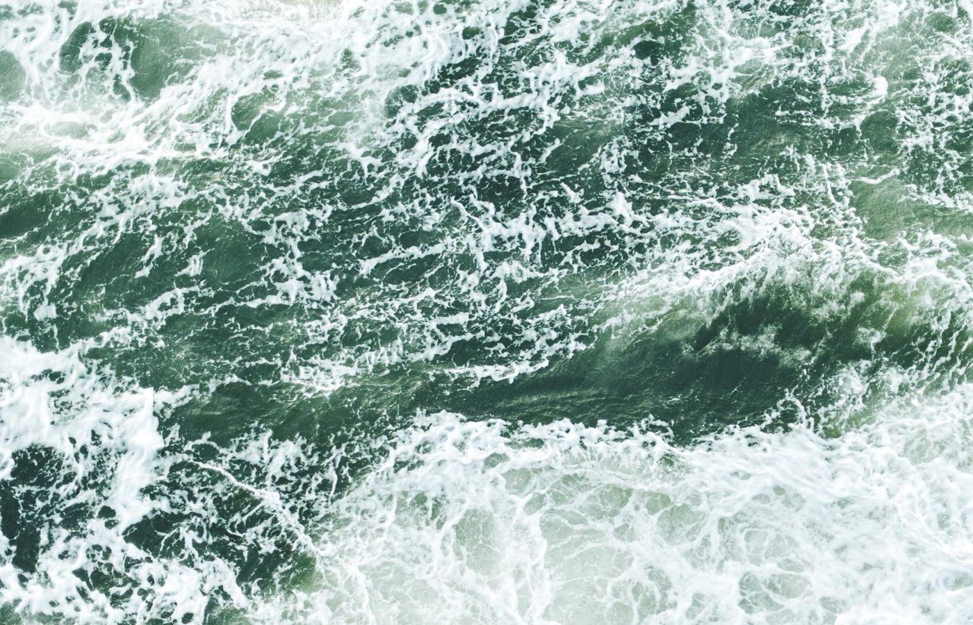 A person working on complex data on a computer screen